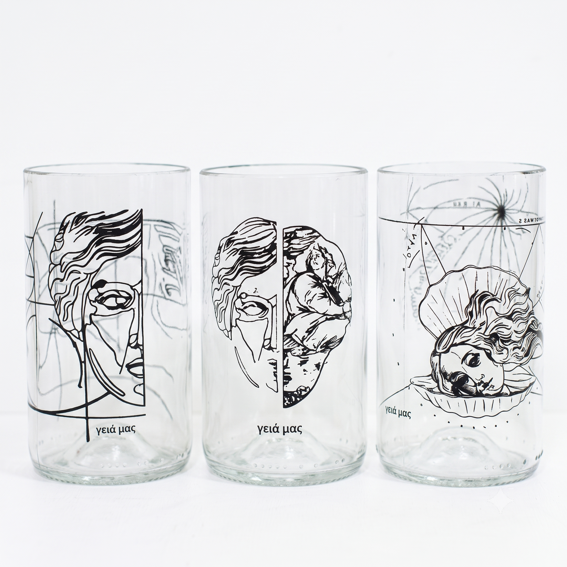 Set Γειά μας di 3 bicchieri trasparenti in vetro recuperato con serigrafia nera di Pietro Fiori